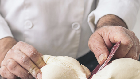 Baker Dividing Bread Dough Into Pieces - Bakery - AAK