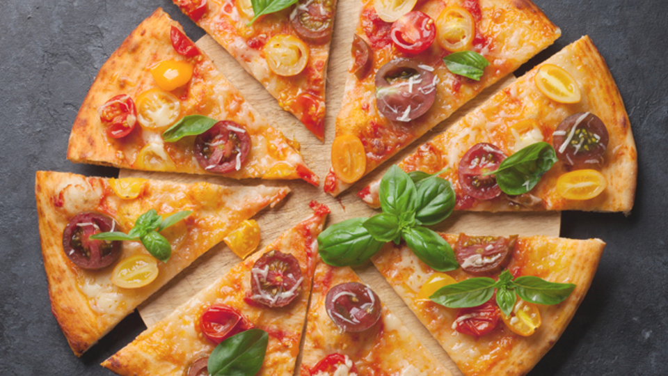 Delicious Pizza with Basil and Tomato on a Marble Table - Bakery - AAK