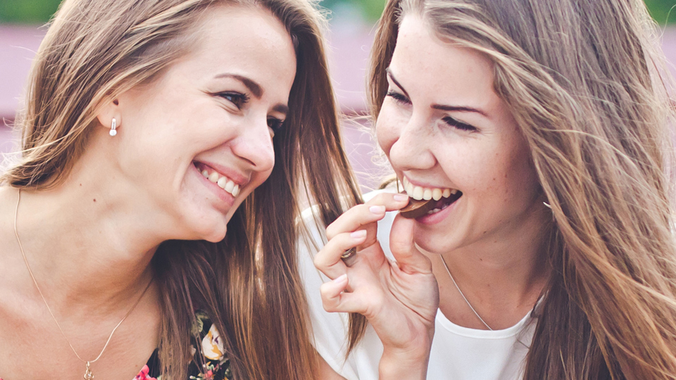 Smiling Women Eating Chocolate - Chocolate and Confectionery - AAK