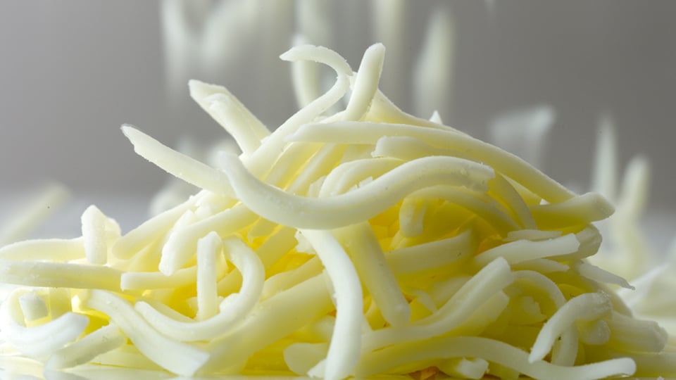 Close-up of a pile of grated cheese - Co-Development - AAK