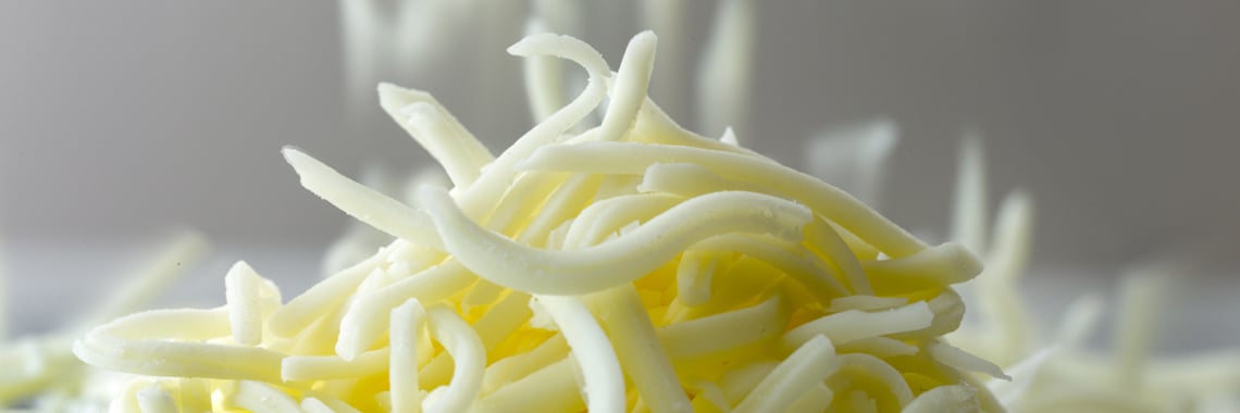 Close-up of a pile of grated cheese - Co-Development - AAK