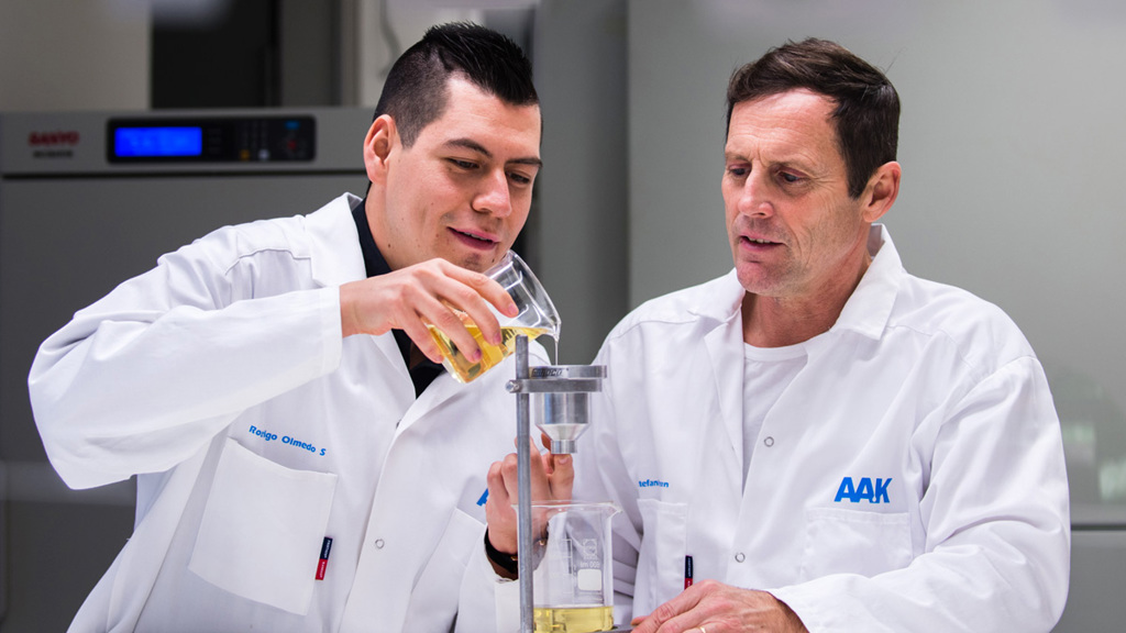 Two men wearing white coats in laboratory - Special Nutrition - AAK