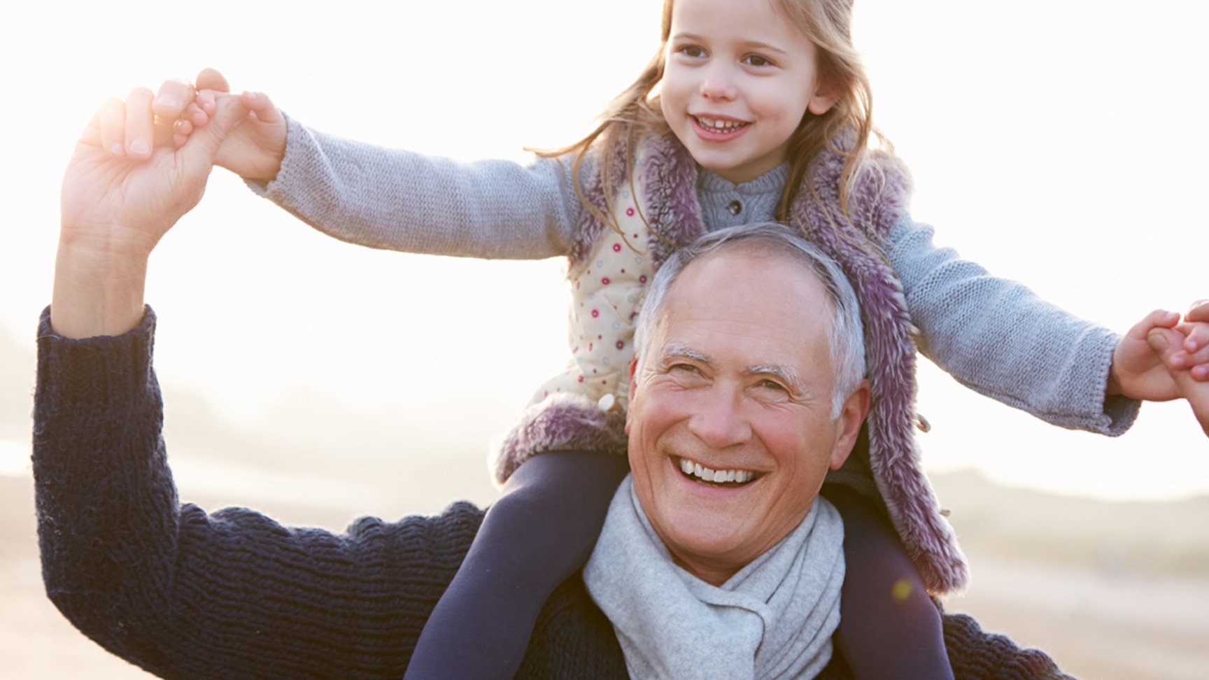 Happy girl sitting on old, laughing man's shoulders - Special Nutrition - AAK