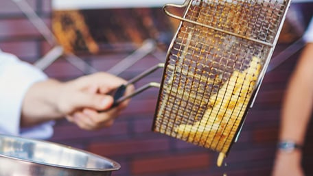 Close-up of Fried Potato Chips in Oil - Foodservice and Retail - AAK