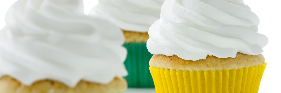 Muffin in colorful forms and topped with whipped cream - Co-Development - AAK