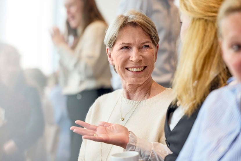 Female employees talking and launching at an AAK office