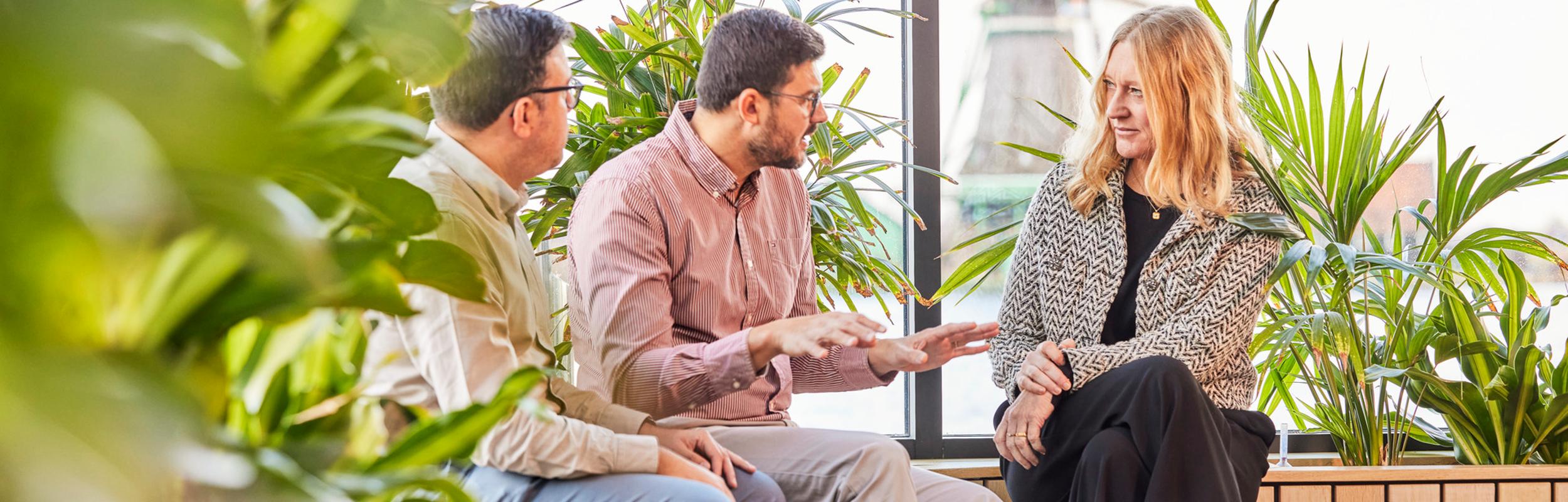 Employees talking in Zaandijk office.